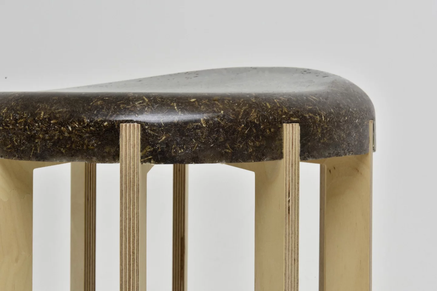 The manure/binder mix retains the "detail of the material" for this stool made of stool