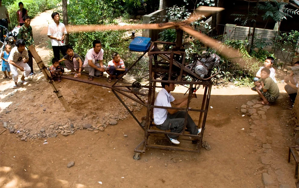 Wu Zhongyuan, then 20, demonstrates his home-made helicopter in 2009