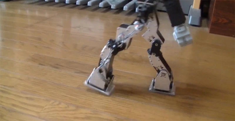Masahiko Yamaguchi's modified KHR-3HV humanoid walks more like a human – note that its leading foot lands on its heel