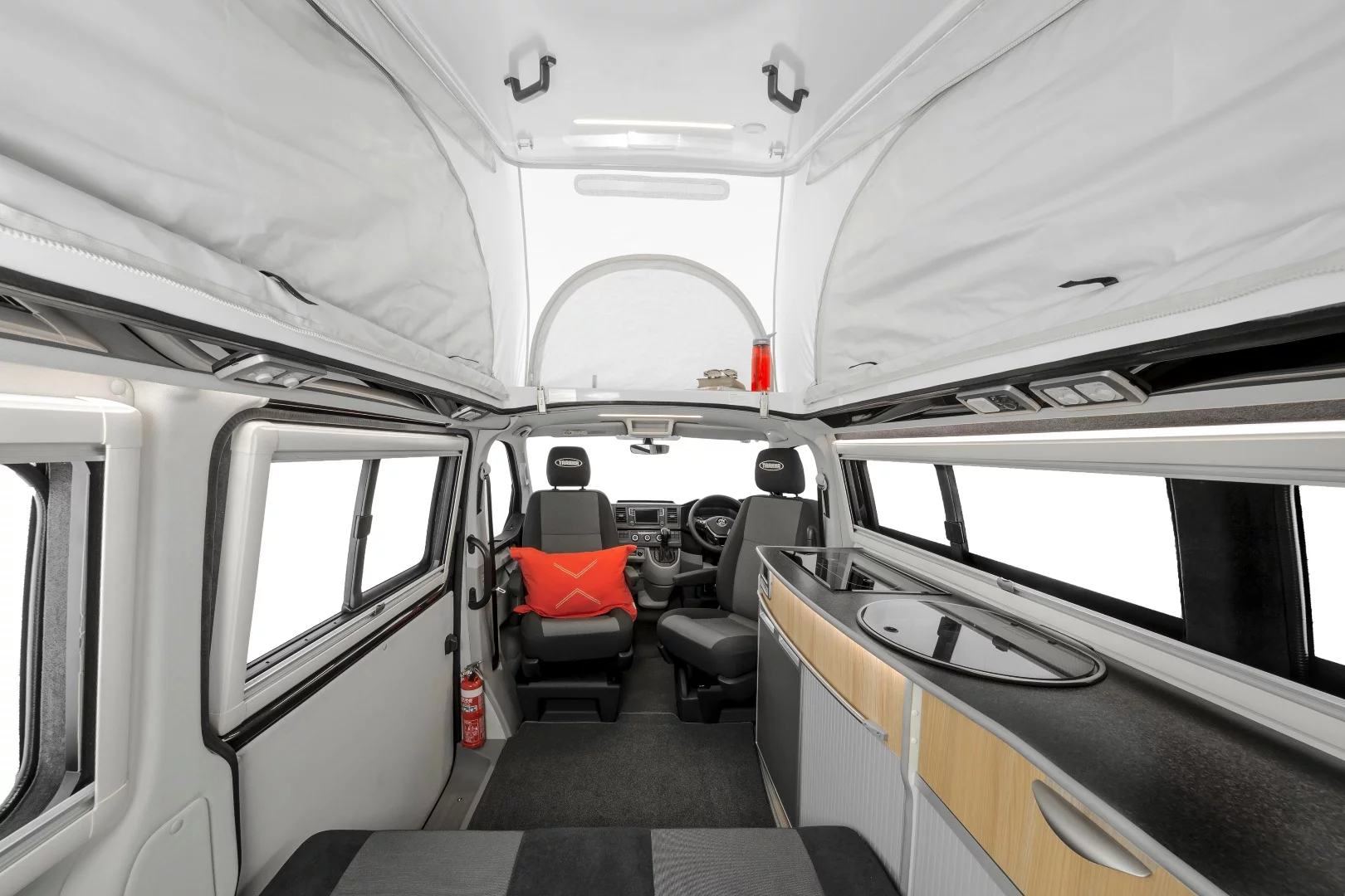The Trakkadu AT interior includes a sliding rear bench/folding bed, swivel front seats and a kitchen area