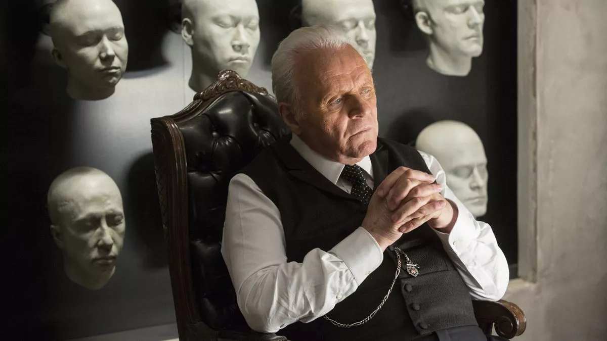 Anthony Hopkins in front of his favorite robot heads in Westworld