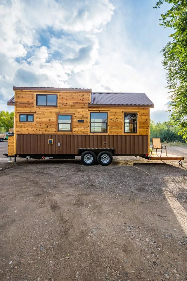 Davis's 22 ft Off-Grid Tiny Home is clad in cedar, with metal accenting