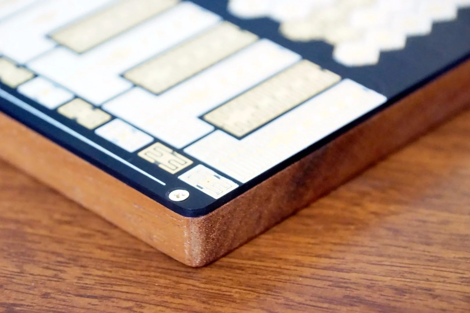 The Premium Hyve synth is mounted to a walnut wood case