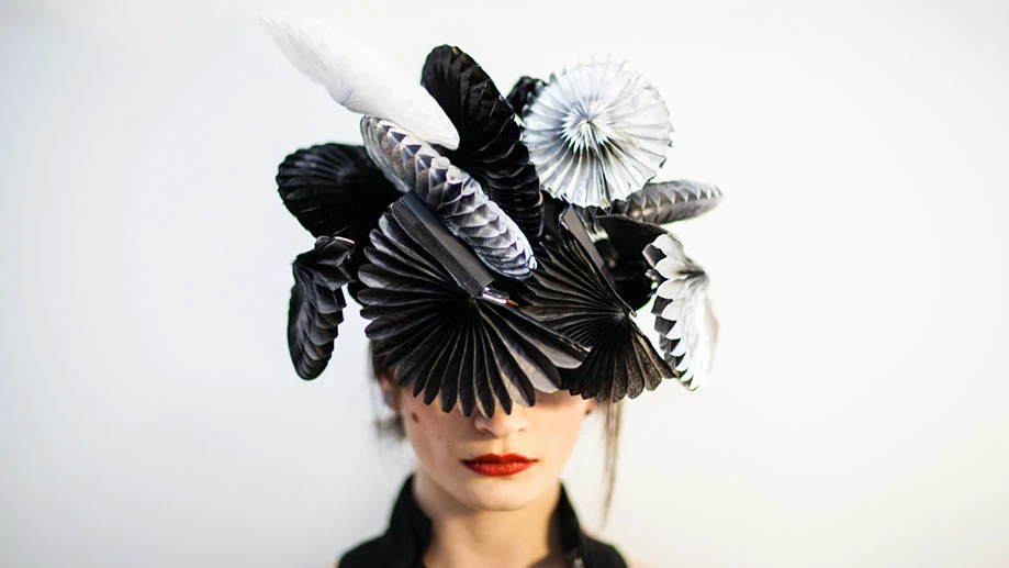 Fans on the hat instantly unfold to shield the wearer from loud noises, bright lights or unwanted proximity when triggered (Photo: Sangli Design)