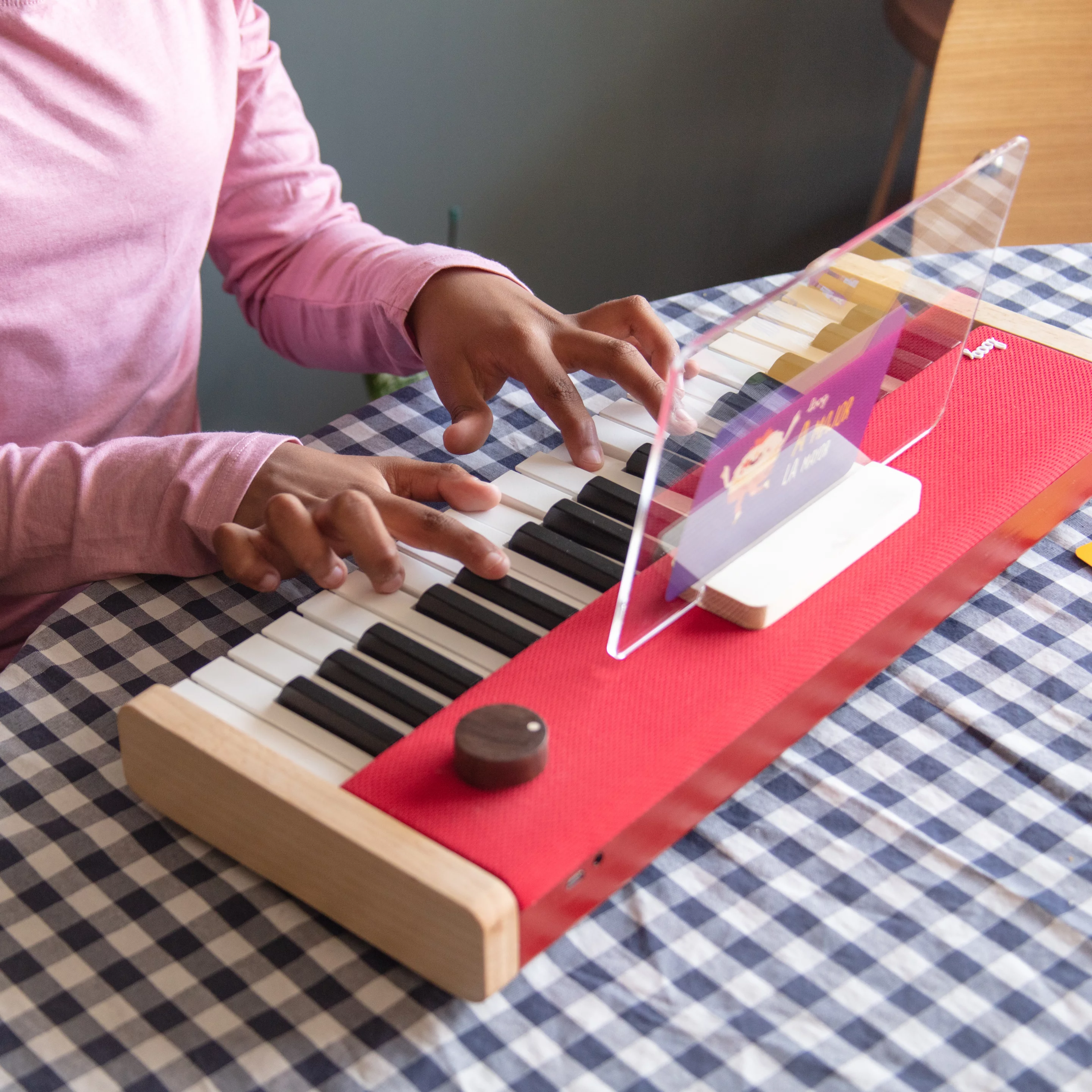 The Loog Piano can be had with a magnetic music stand, carry case and legs