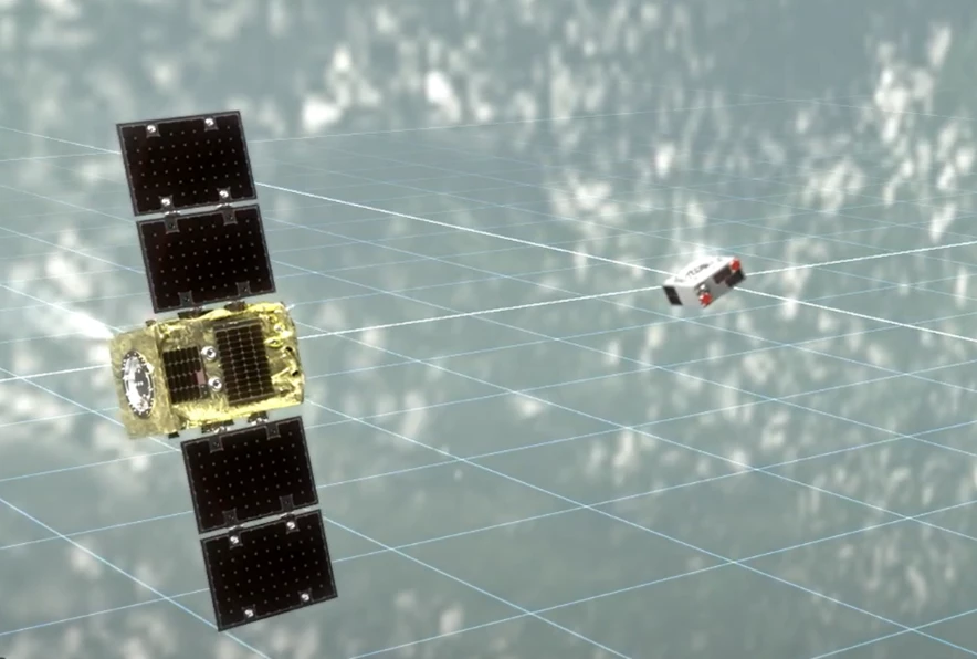 Artist's illustration of the capture of tumbling debris