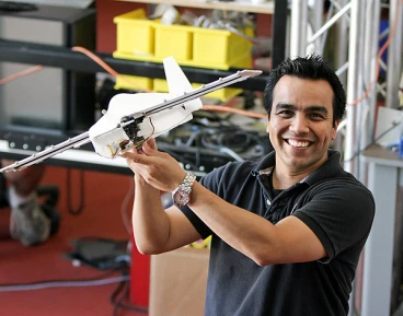 Postdoctoral Associate Rick Cory poses with the perching glider he helped develop (Image: Jason Dorfman/CSAIL)
