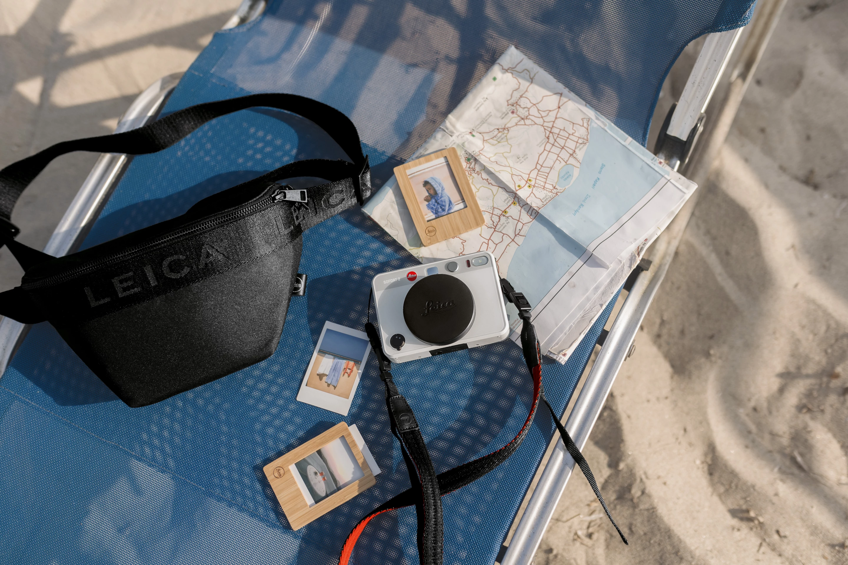 The Leica Sofort 2 launches with a bunch of accessories, including wooden photo frames for prints, camera straps and carry bags