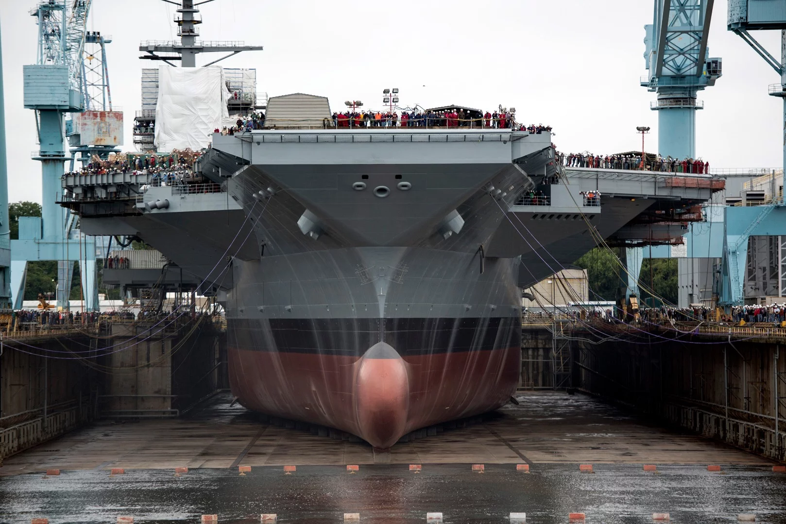 Newport News Shipbuilding begins flooding Dry Dock 12 to float the aircraft carrier USS Gerald R. Ford