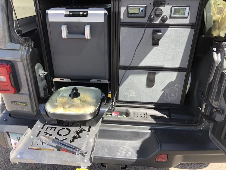 Beyond just an induction cooktop, the Juice Box can power all kinds of electric appliances you wouldn't otherwise use out in the wild