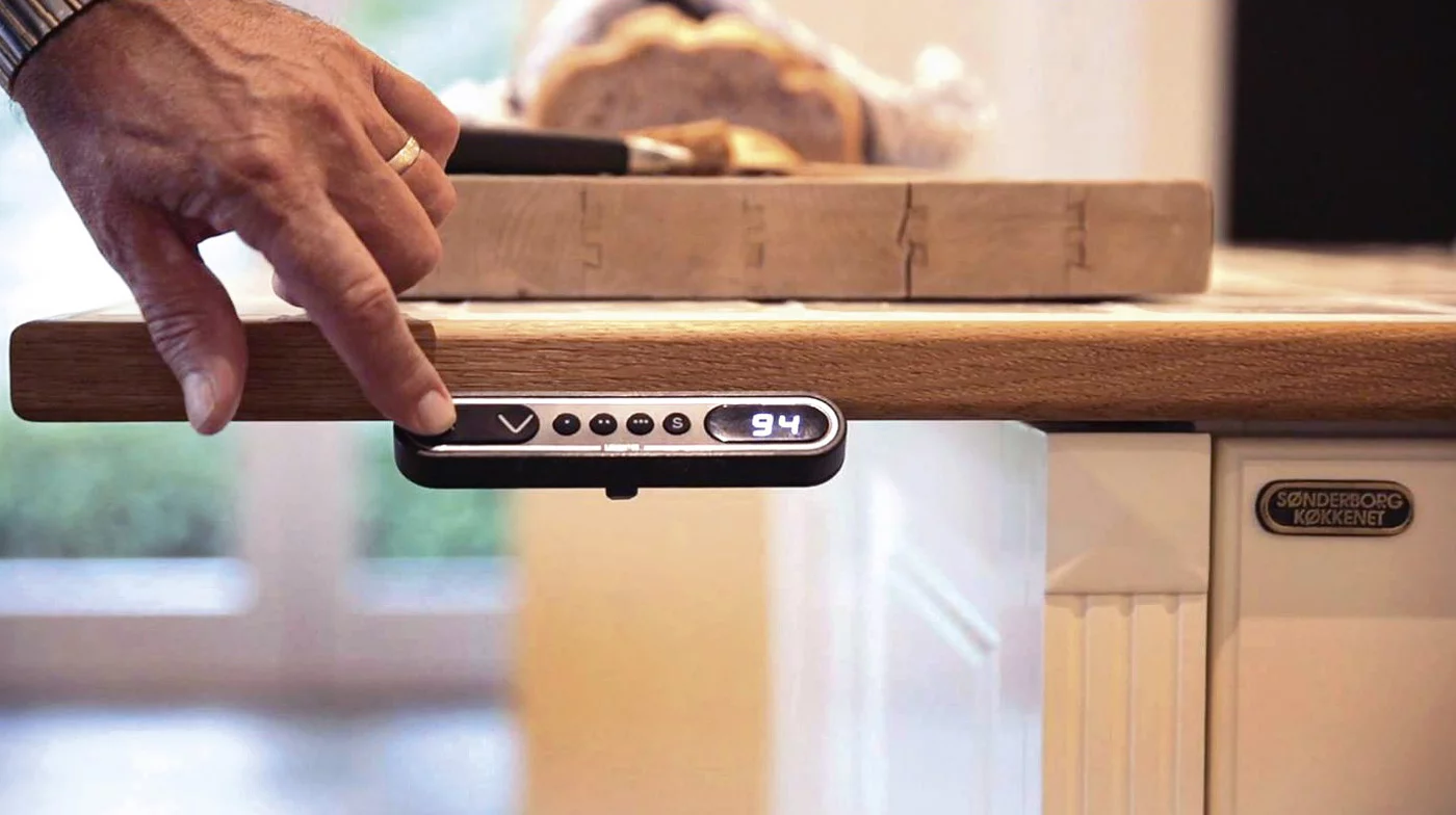 Users can adjust the height of a kitchen unit by simply pressing up or down Baselift system buttons