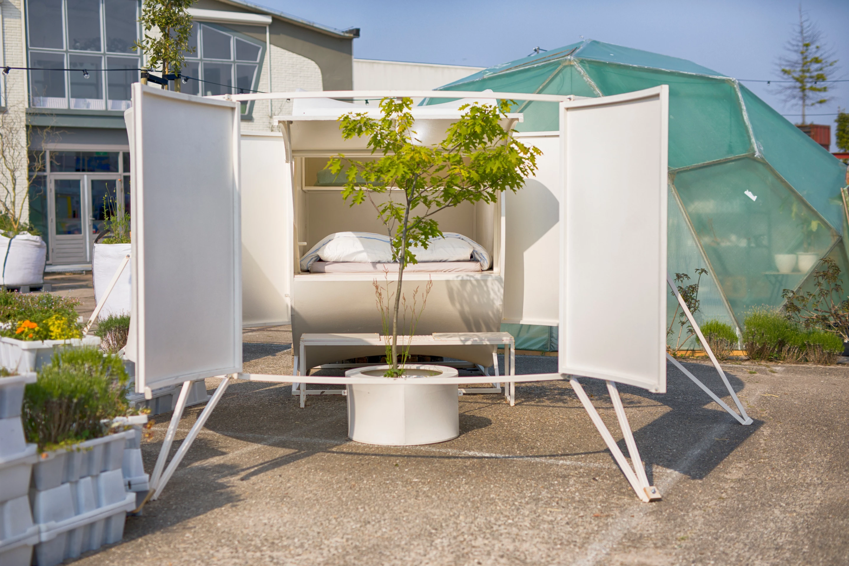 Second Skin is made from scrap materials and features a private garden area with a small potted tree. It was designed by Rob Sweere