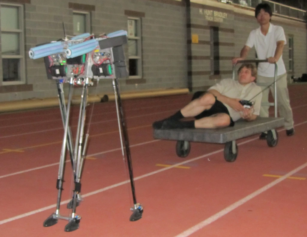 Jason Cortell reclines as Lipeng Yuan pushes him after Ranger