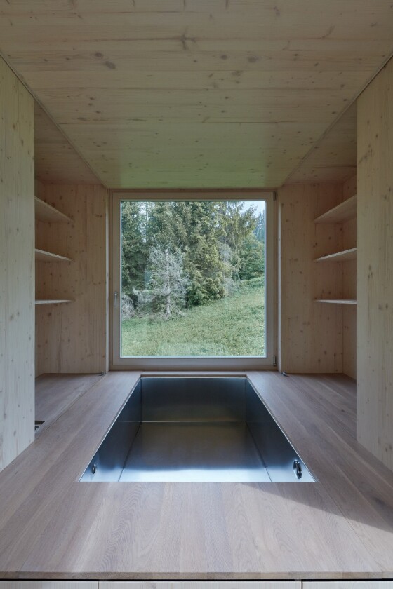 The bed inside the Into the Wild cabin can be raised to reveal a sunken Jacuzzi