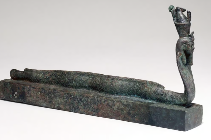 The coffin adorned with the human-headed part-eel, part-cobra imagery linked to Egyptian god Atum