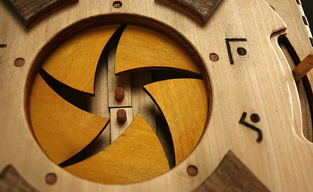 The first stage is unlocking the mechanical iris on the cover