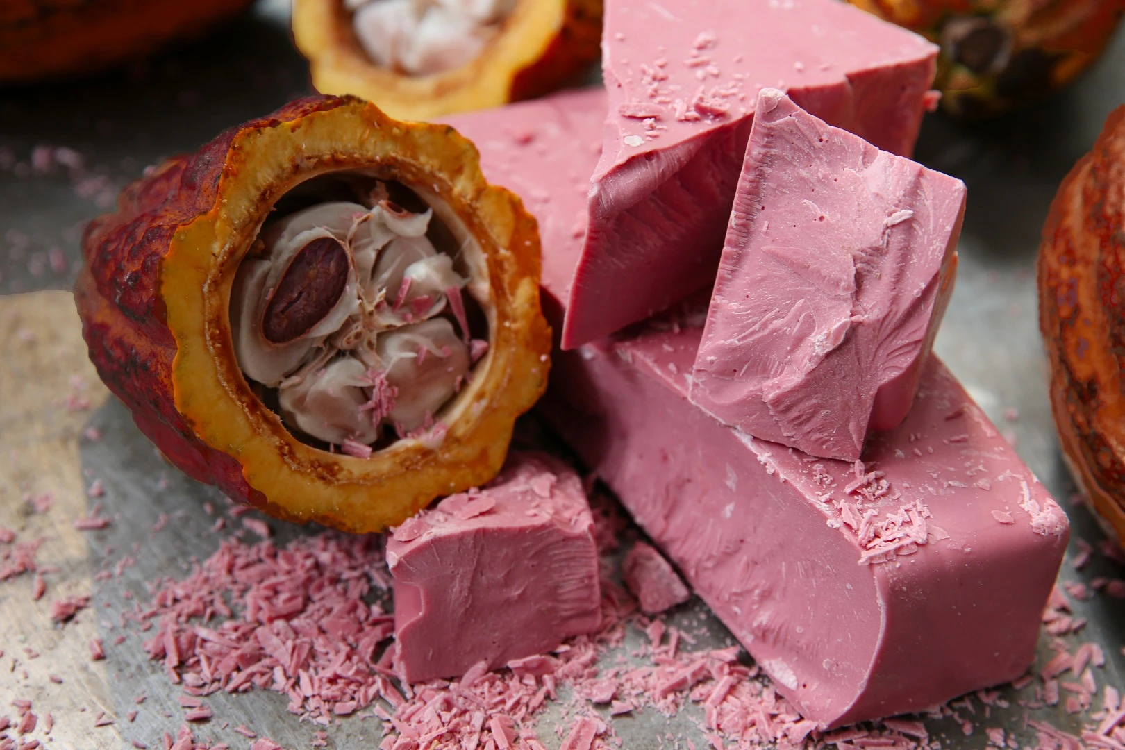 Chunks of ruby chocolate, along with the ruby cocoa bean