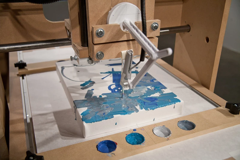 The Interactive Robotic Painting Machine responds to sounds in the environment as it paints (Photo: Benjamin Grosser)