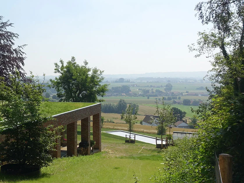 The home's green roof renders the home invisible from street level