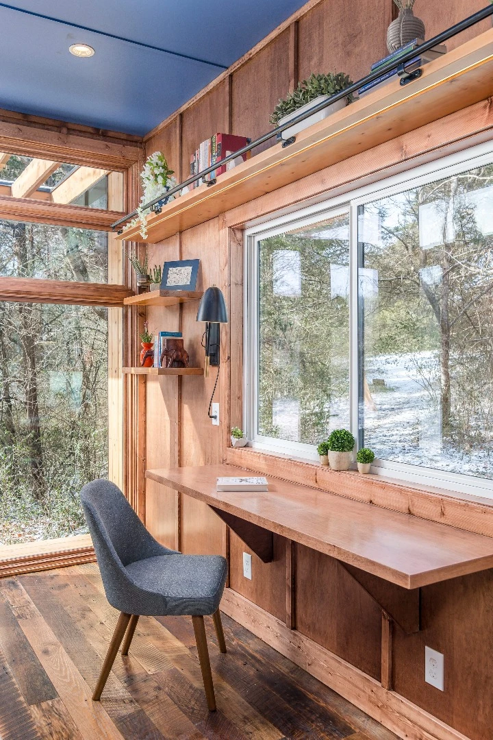 The Cornelia tiny house features reclaimed hardwood flooring, along with solid maple and maple plywood walls and ceiling inside