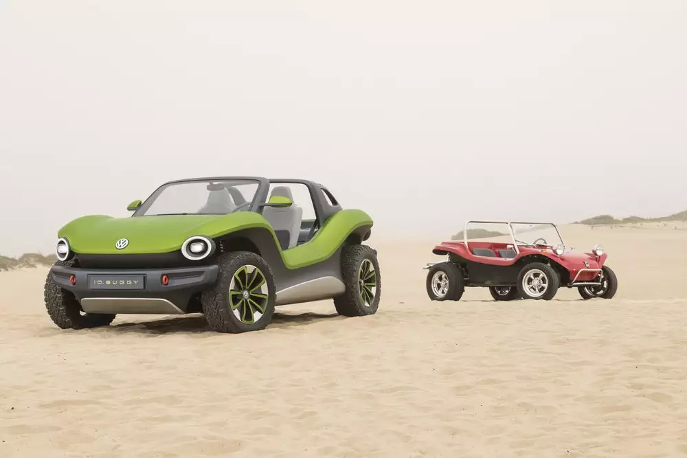 The VW ID. Buggy alongside a Meyers Manx dune buggy