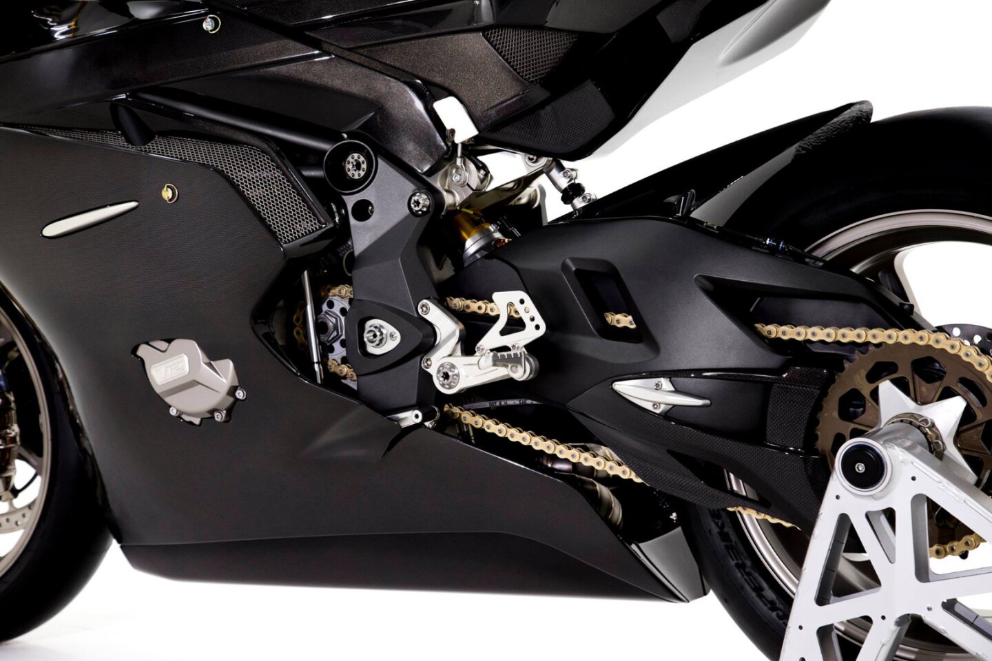 Aluminum plates binding together the steel frame and the magnesium swing arm of the Tamburini T12 Massimo
