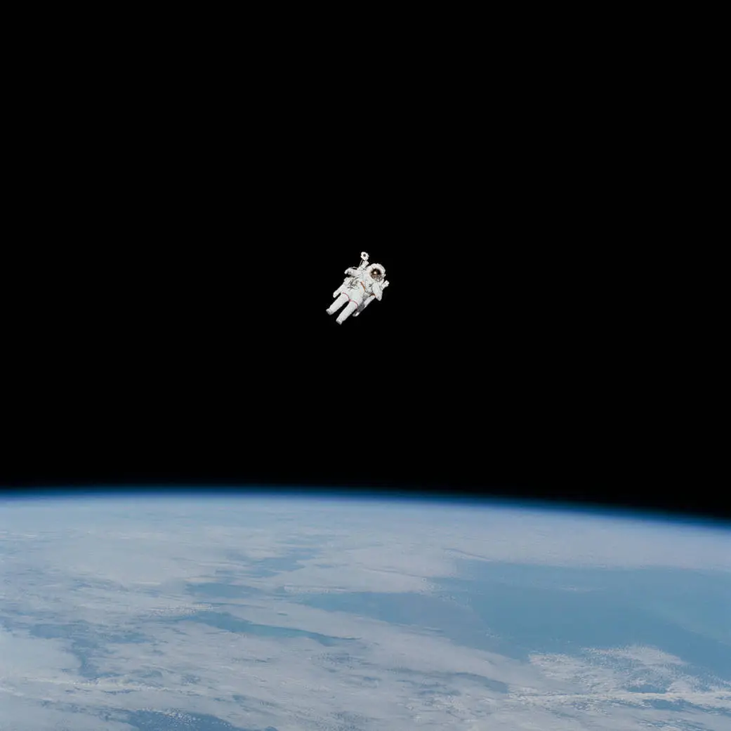 NASA astronaut Bruce McCandless tries out a nitrogen-propelled backpack, or Manned Maneuvering Unit (MMU), during the first untethered spacewalk on February 7, 1984