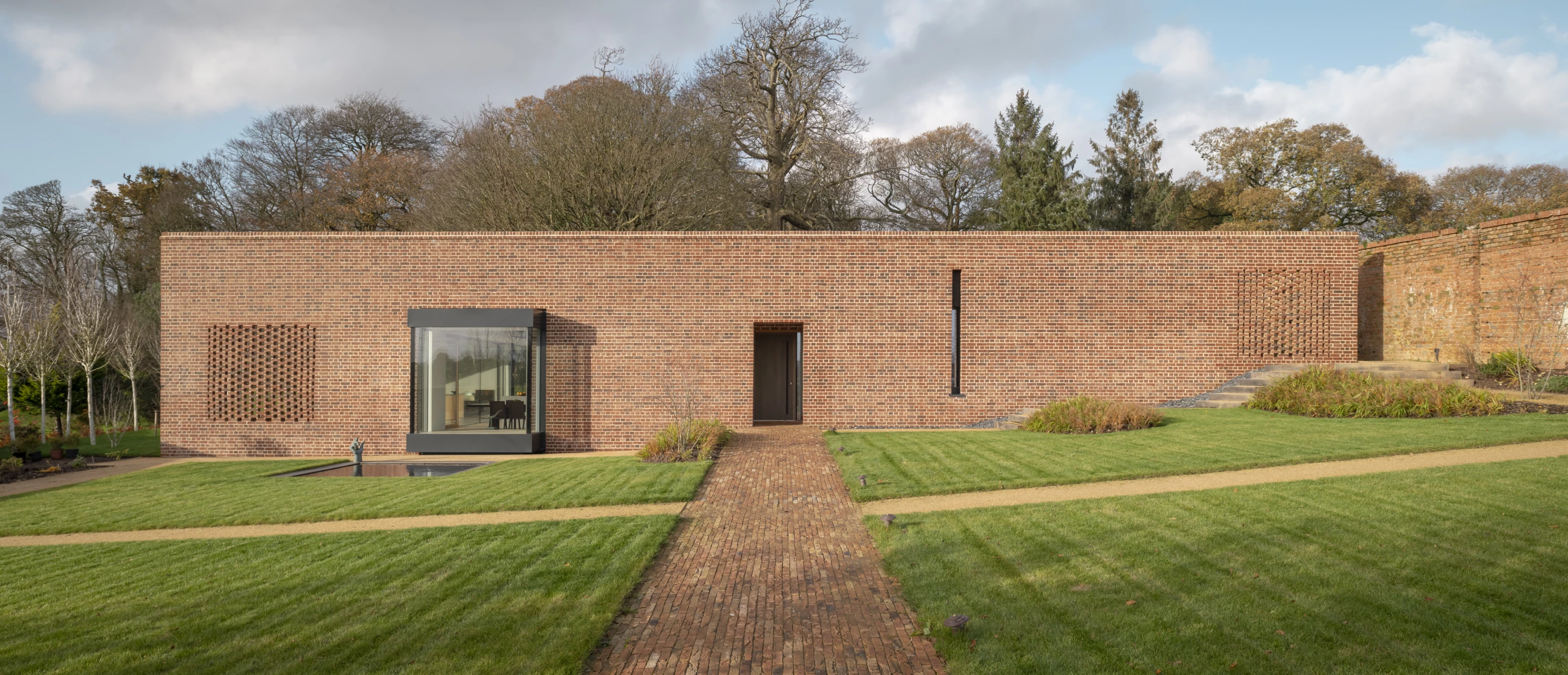 Devon Passivhaus was designed by McLean Quinlan and is located in Devon. It's situated inside the garden of an old mansion and has been designed to be both sympathetic to its local surroundings and extremely energy efficient