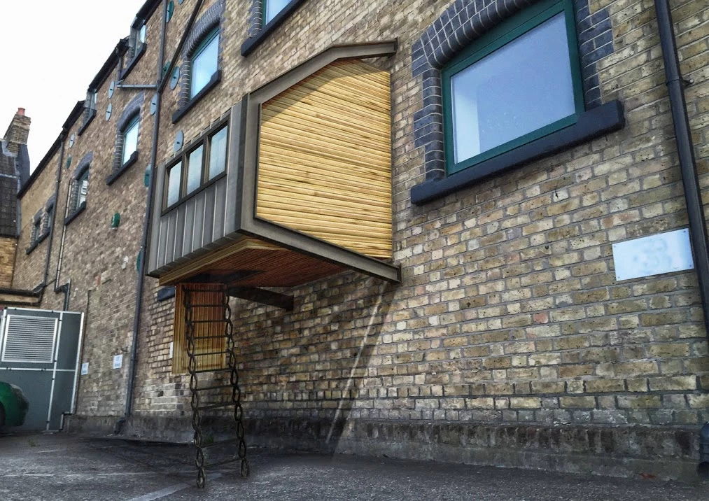 Each pod comprises two steel frame sections that attach to a wall at four points and then hold the structure together and in place