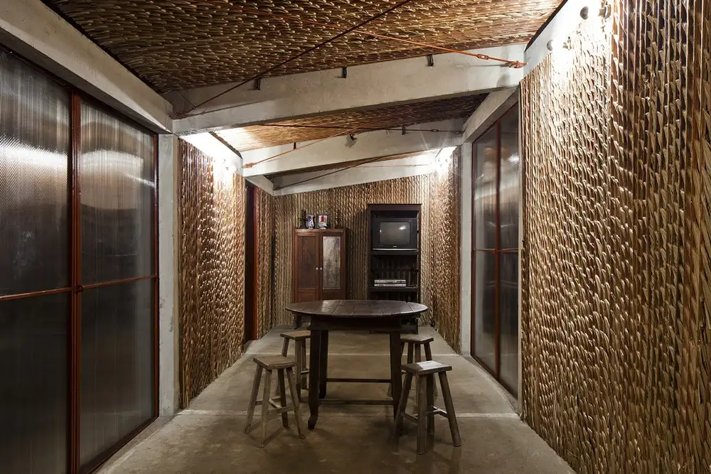 The interior of the S House by Vo Trong Nghia Architects is basic, measuring just 30 sq m (322 sq ft), and includes one long room as standard. Large polycarbonate panels allow in plenty of natural light and can also be opened for access and to encourage ventilation