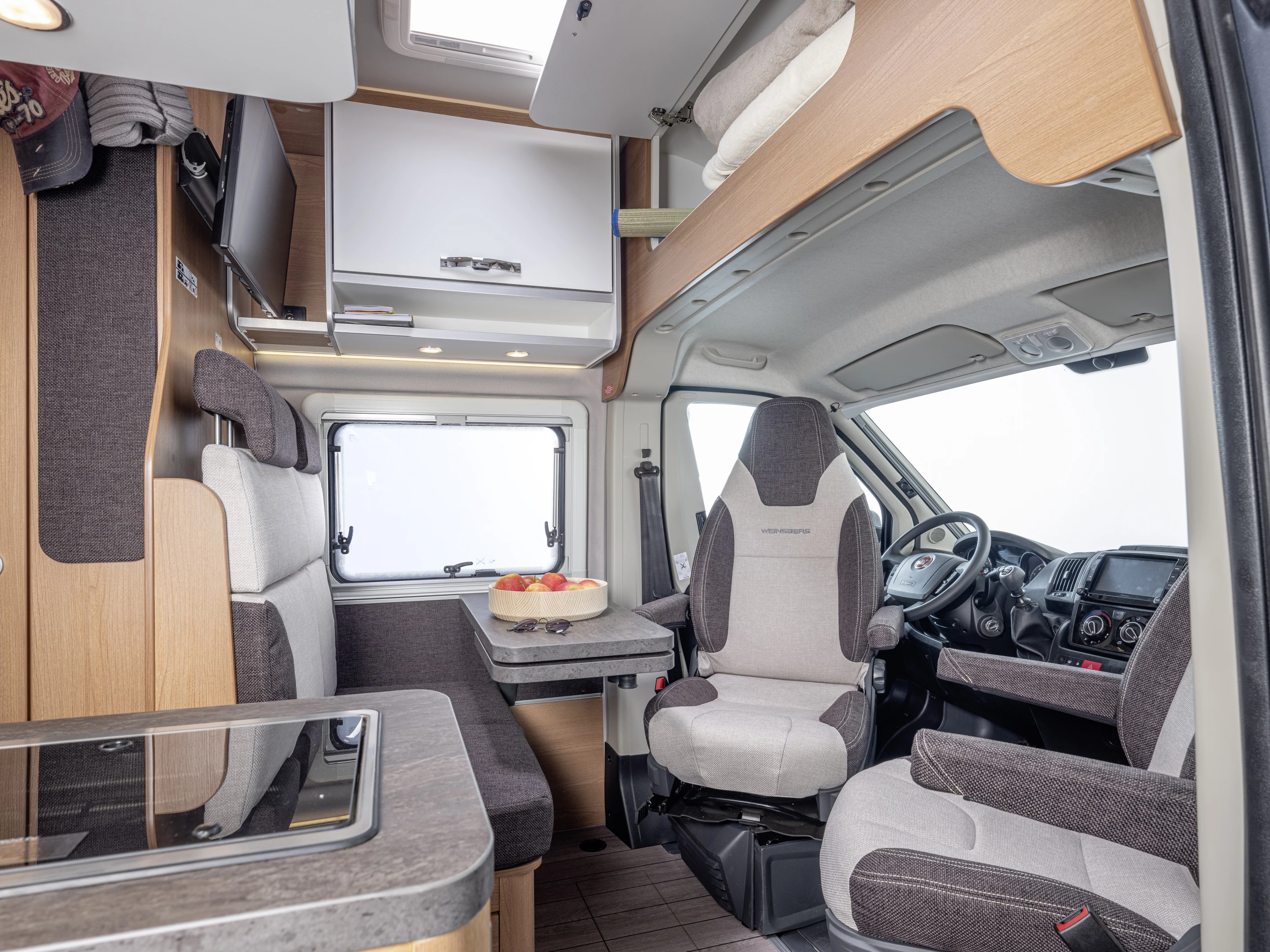 The MEG Outlaw floor plan includes a typical four-person front dinette with removable tabletop