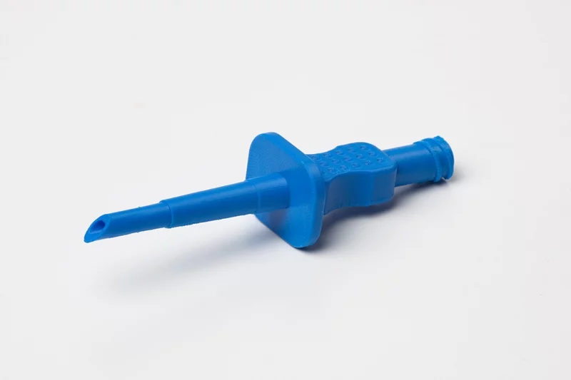 A Stratasys 3D-printed saline probe, produced from ABS Plus material, used to pierce a saline bottle and prime the Hemosep bag prior to use