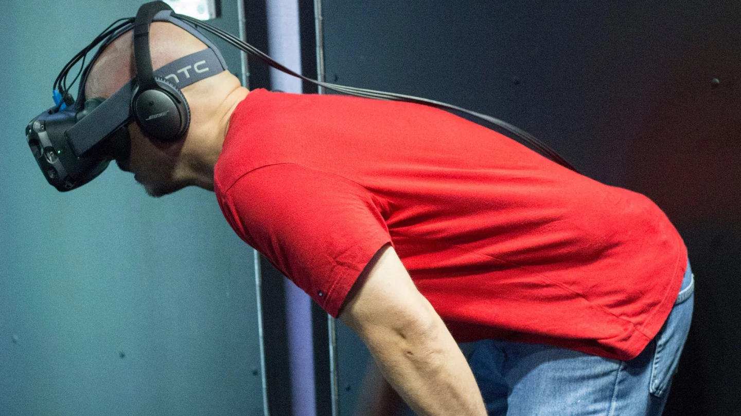 Leaning down to examine something in one of the HTC Vive's virtual worlds