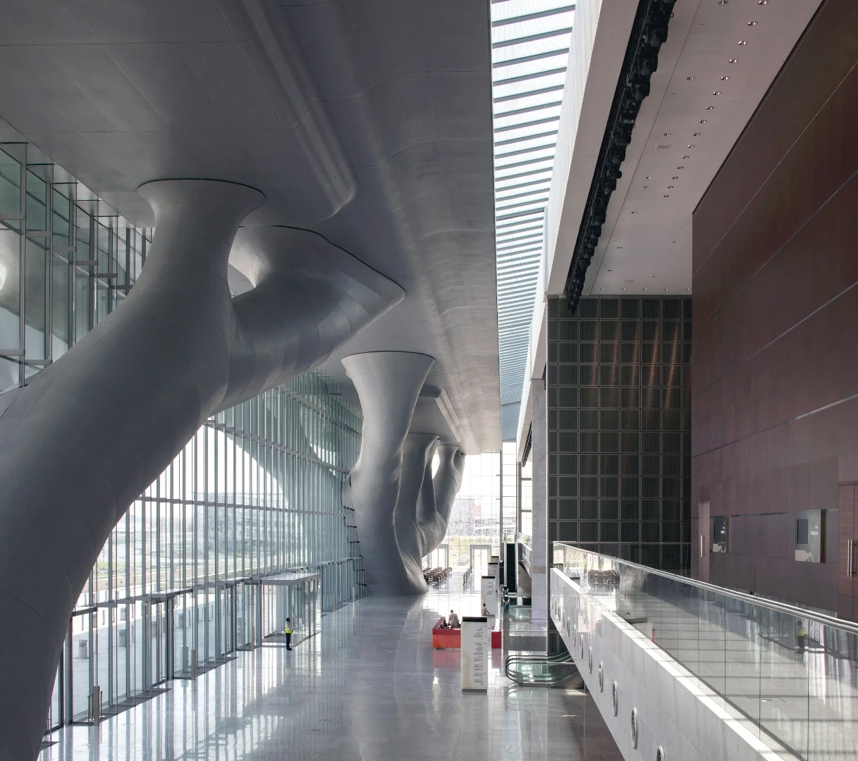 The Qatar National Convention Center is defined by eye-catching tree-like columns that appear to be supporting a cantilevering roof
