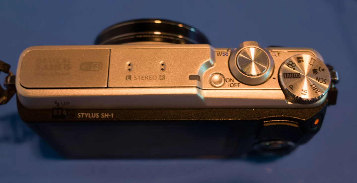 The Olympus Stylus SH-1 has a 16-megapixel 1/2.3-inch-type CMOS sensor
