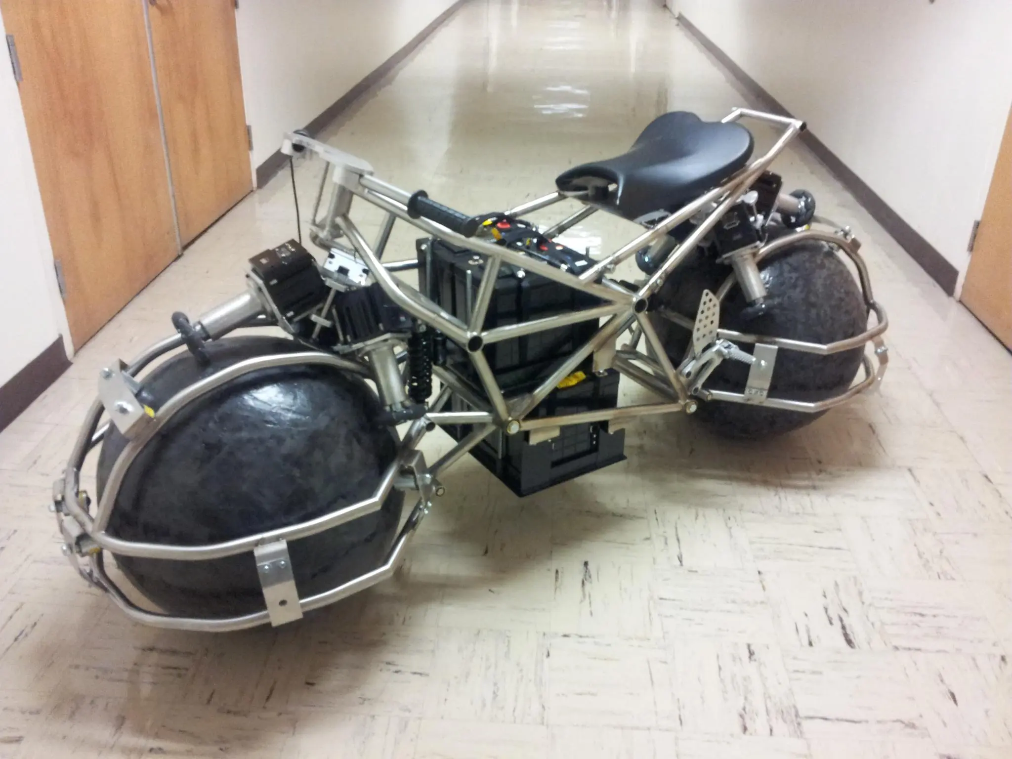 The battery packs are installed and the SDS motorcycle is ready for the camera, but there's still a long way to go before it's operational