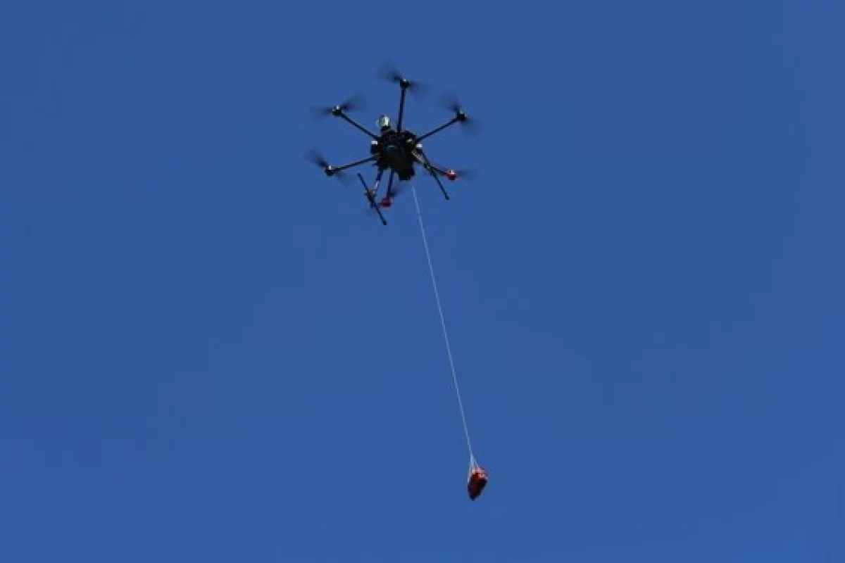 A drone delivers a defibrillator as part of real-world testing