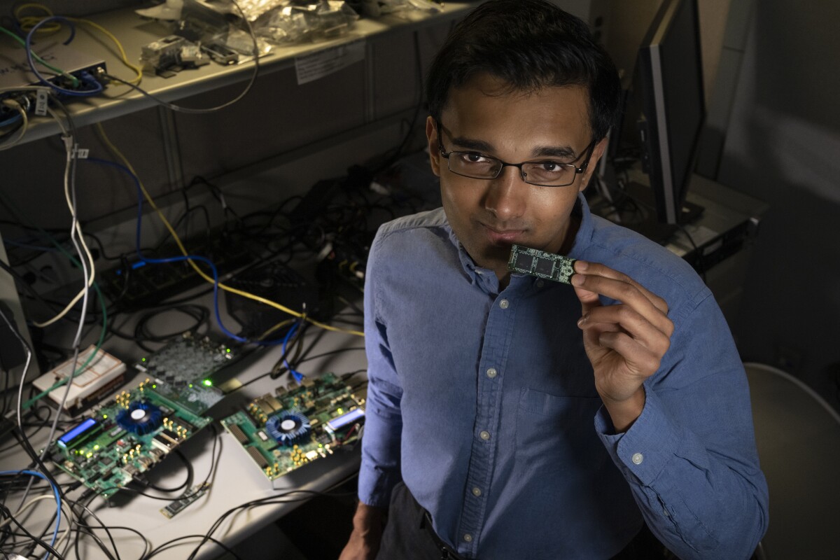 Intel Labs’ Nabil Imam holds a Loihi neuromorphic test chip in his Santa Clara, California, neuromorphic computing lab