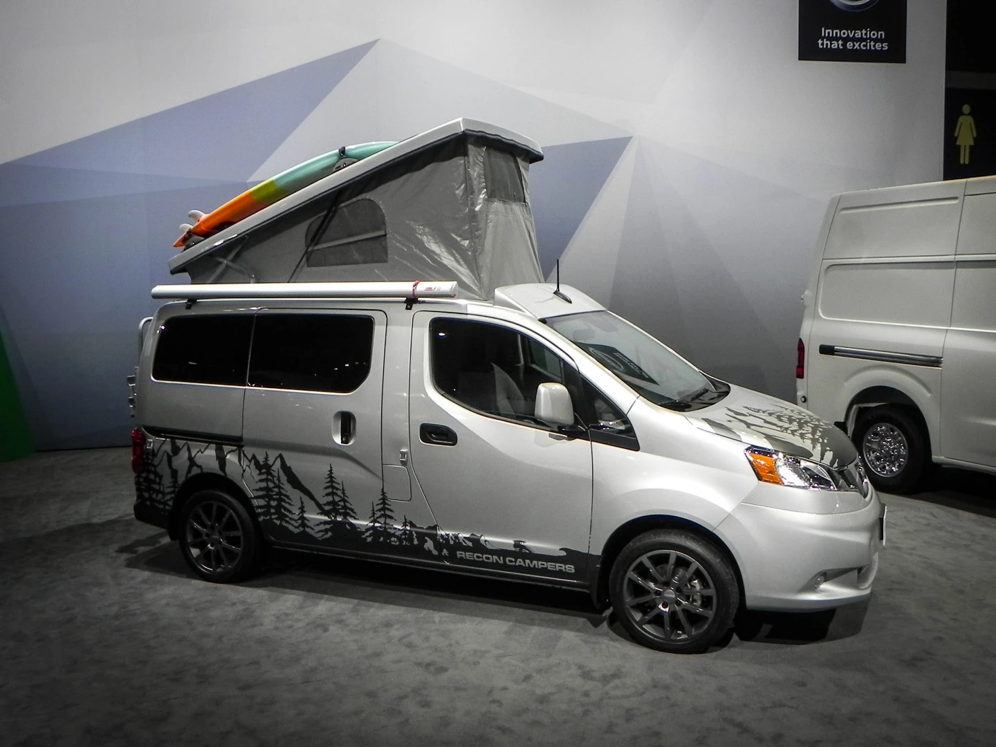 In the Nissan booth at the Chicago Auto Show are things like this aftermarket camper upgrade for the little NV commercial van