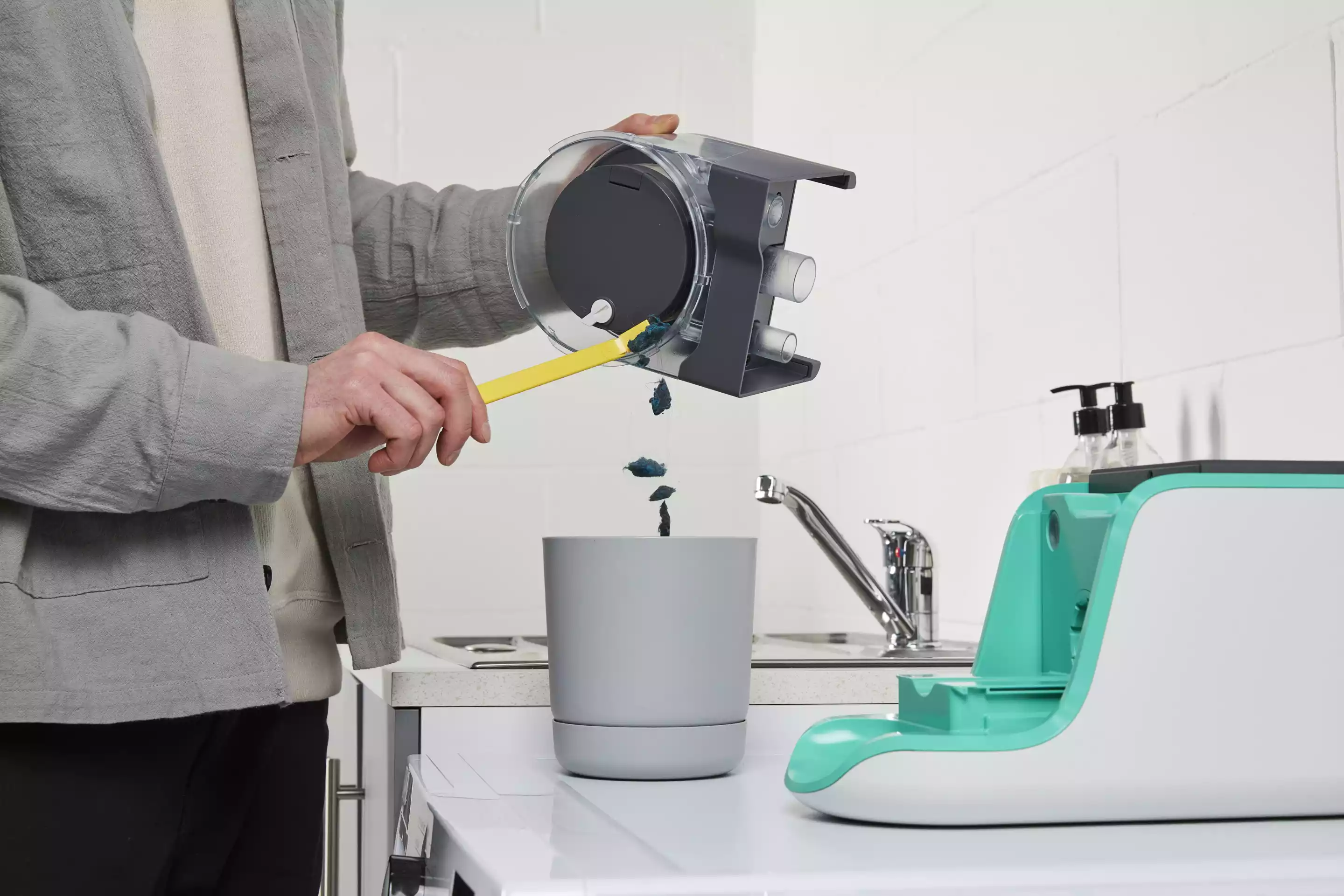 Captured microfibers are emptied out of the Gulp's filter cup