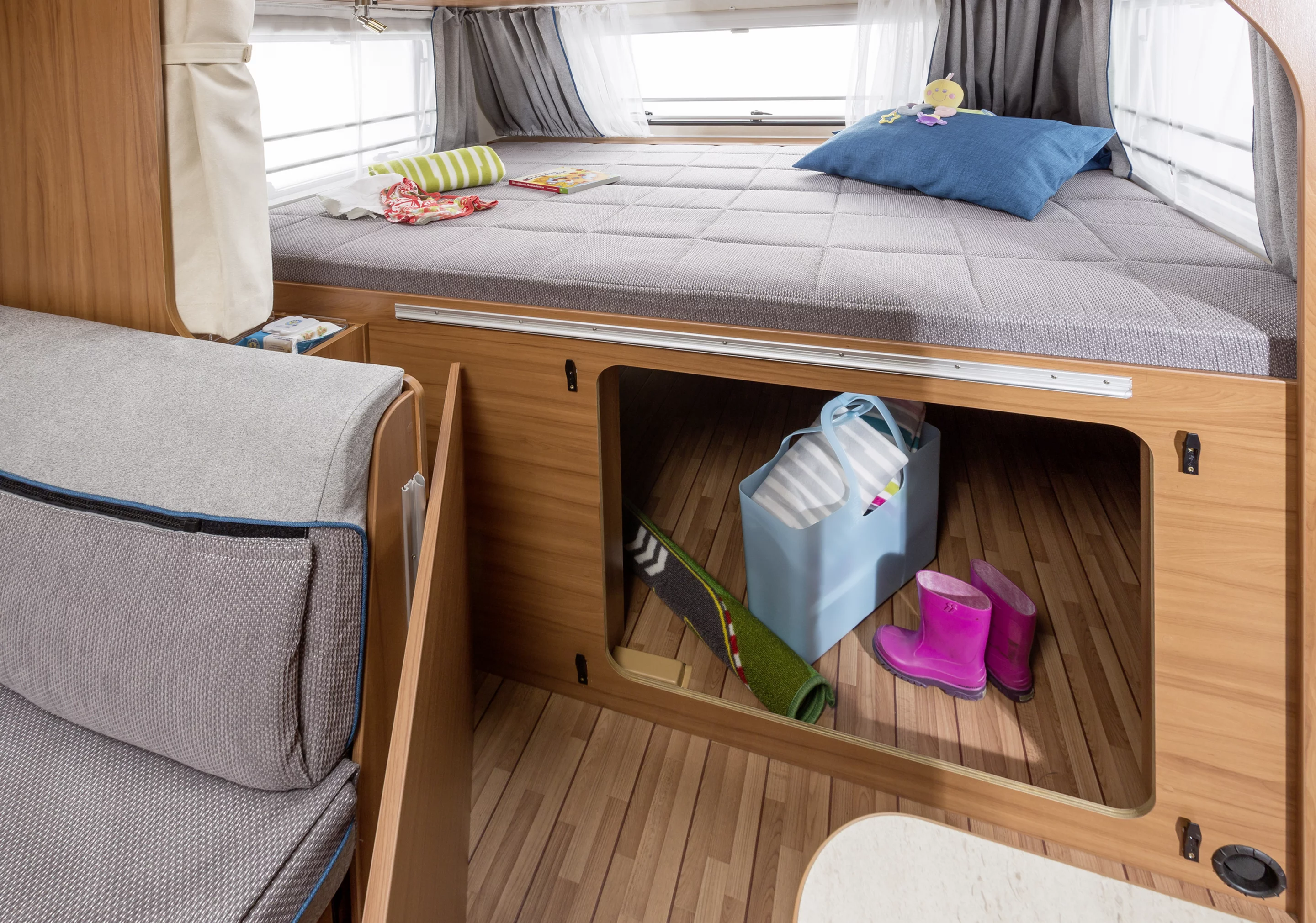 The under-bed storage compartment is accessible from inside and via the exterior access panel