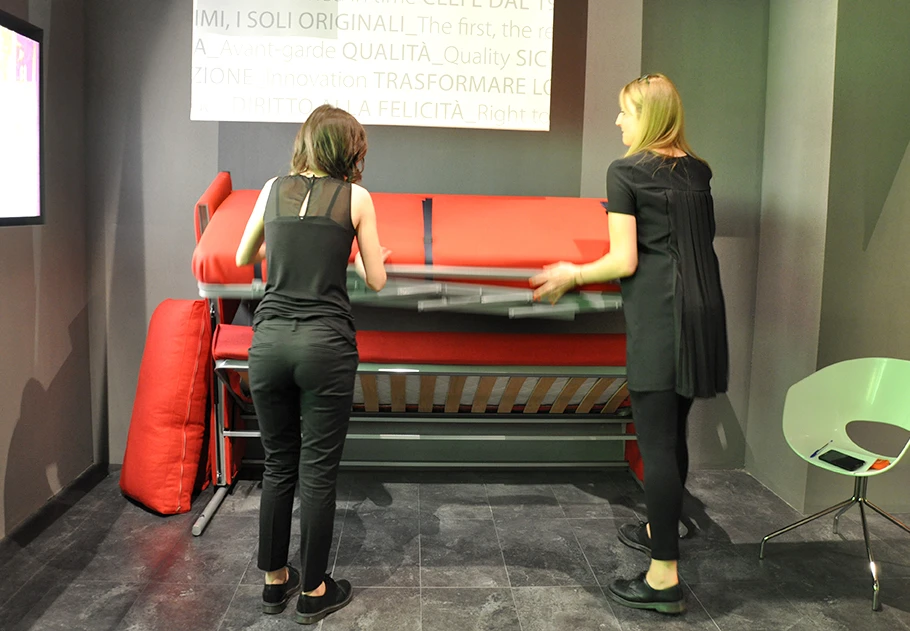 The cushion section folds out and out revealing a second single bed structure underneath