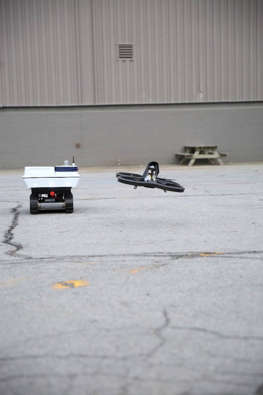 GE robotic rover working in collaboration with a drone