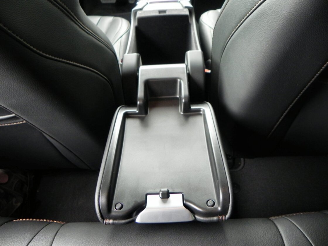 In the V60, the lid for the center console storage box flips all the way back to become a convenient tray for rear passengers