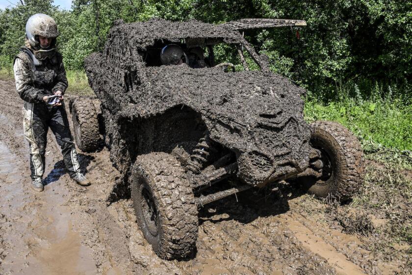 Mud is a big part of the Silk Way Rally. We'd tell you who this actually is, but it's impossible to tell with no number, badge, paint or branding visible. Still, go that driver!