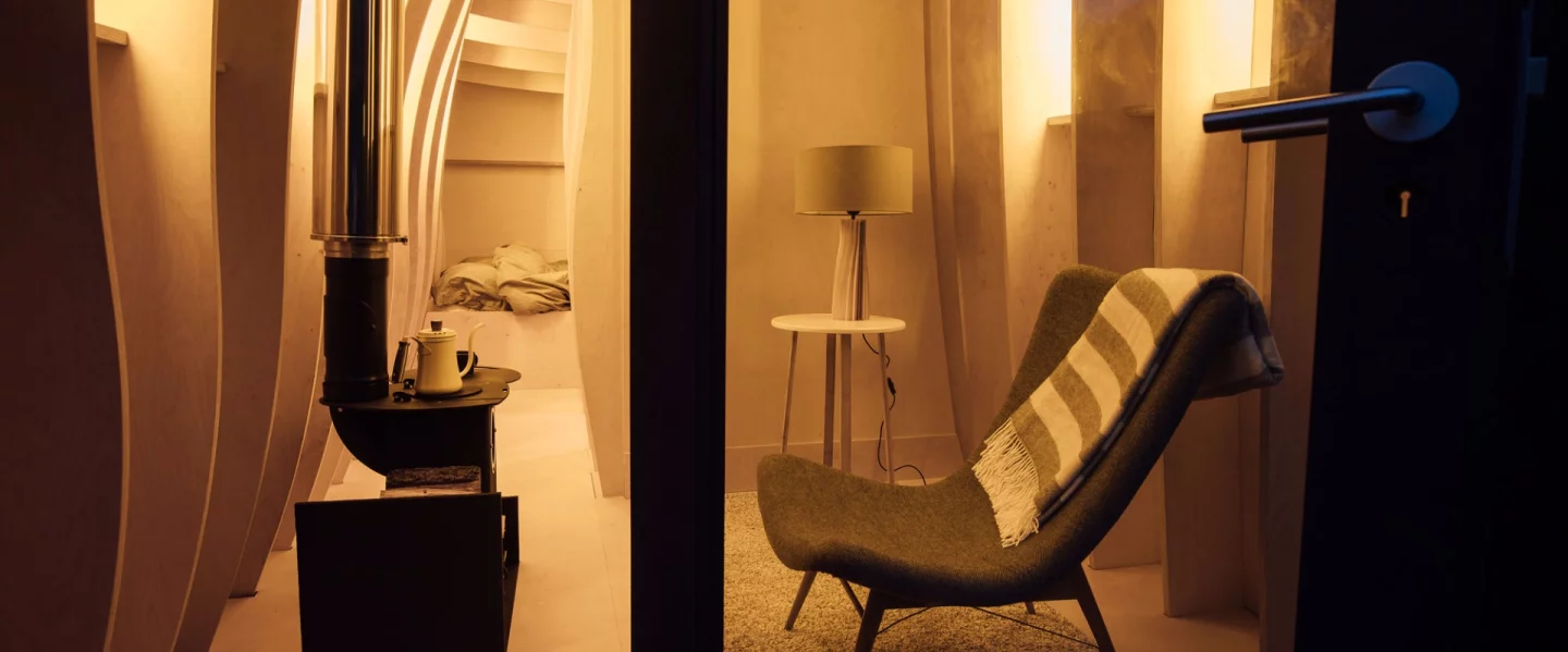 A cosy double bed issnuggled at the rear of the building