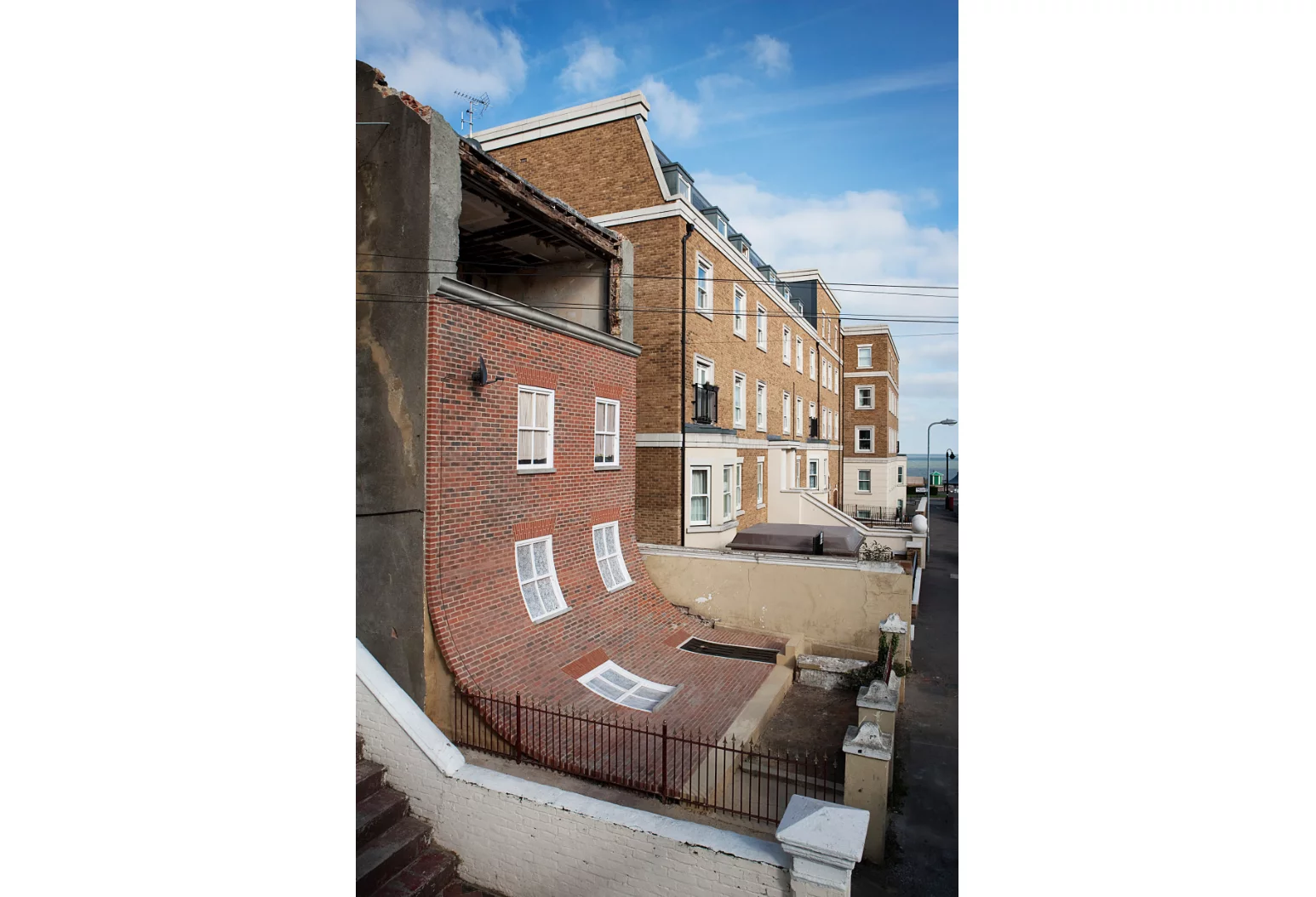From the knees of my nose to the belly of my toes gave the impression a facade was slipping off the building, revealing a top floor usually hidden behind brickwork