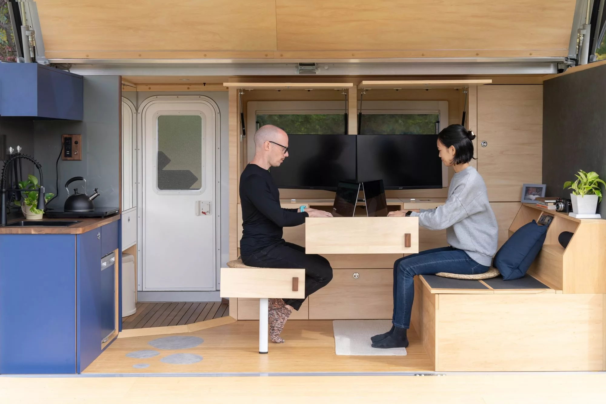 NomadPro occupants can rely on the dual-monitor system or work on their own laptops