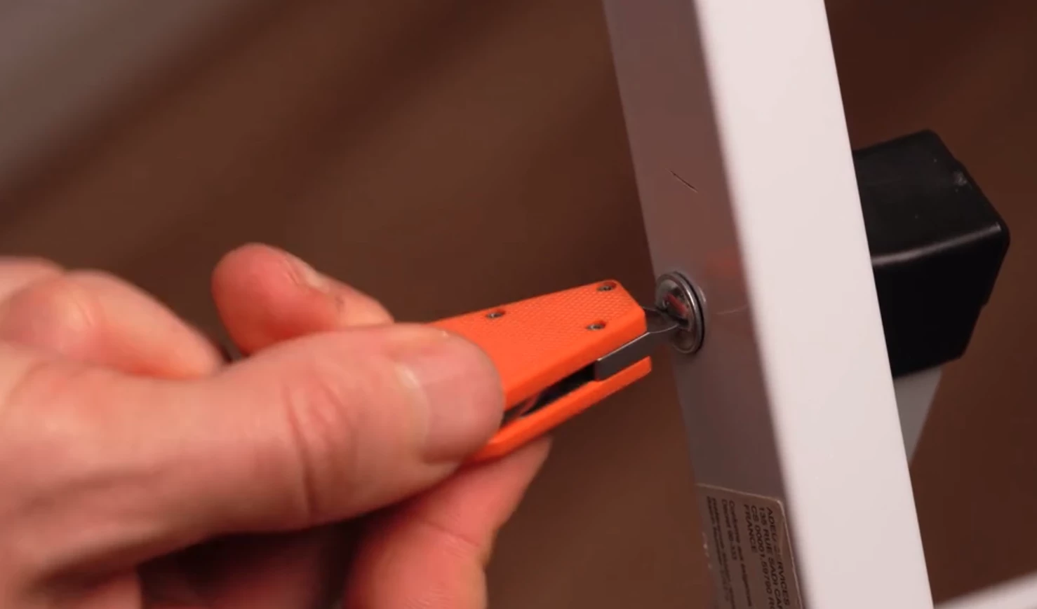 The keyring doubles as a flathead screwdriver and a small pry