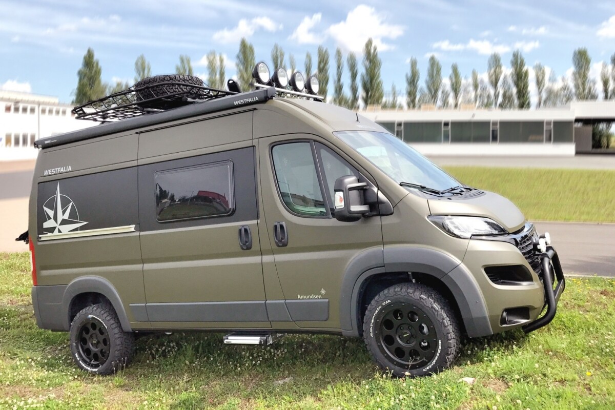 Offroad Westfalia camper van follows the compass toward the dirt, rock